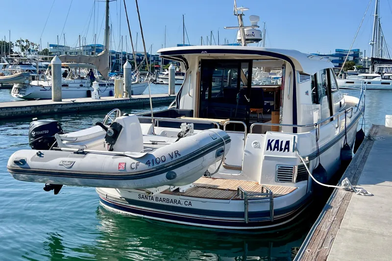Kala Yacht Photos Pics 2018 Nimbus 365 Coupe docked with inflatable boat, Santa Barbara marina.