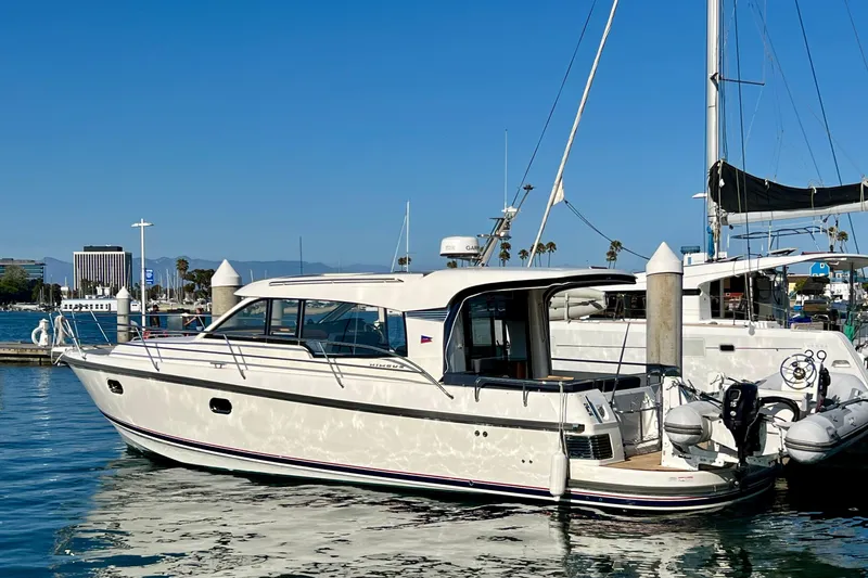 Kala Yacht Photos Pics 2018 Nimbus 365 Coupe yacht docked in a sunny marina.