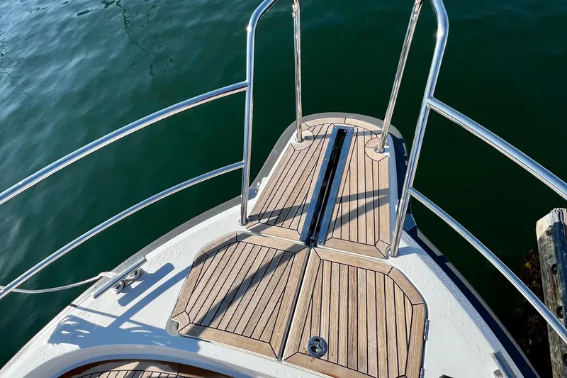 Kala Yacht Photos Pics Bow view of 2018 Nimbus 365 Coupe with teak decking and stainless steel railings.
