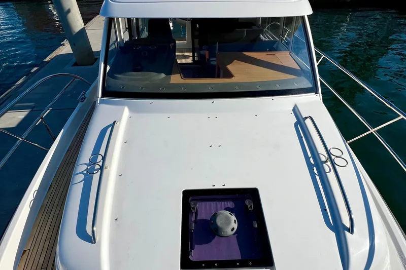 Kala Yacht Photos Pics 2018 Nimbus 365 Coupe boat docked, showcasing sleek design and spacious deck.