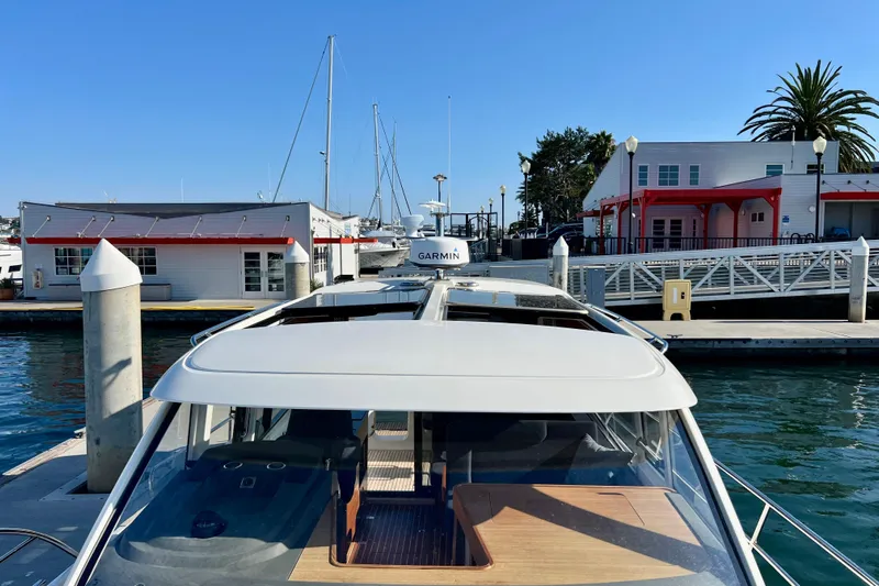 Kala Yacht Photos Pics Nimbus 365 Coupe 2018 docked at marina with clear blue sky.