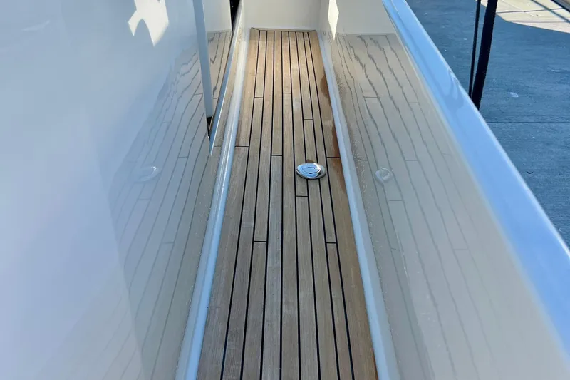 Kala Yacht Photos Pics Teak deck of 2018 Nimbus 365 Coupe boat, showcasing sleek design and craftsmanship.