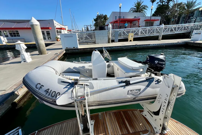 Kala Yacht Photos Pics Inflatable boat with Tohatsu motor docked at marina, near Nimbus 365 Coupe, 2018 model.