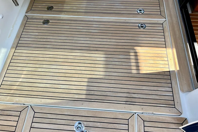 Kala Yacht Photos Pics Teak deck of 2018 Nimbus 365 Coupe, featuring sleek, polished wood finish.