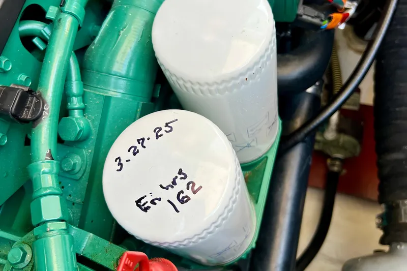 Kala Yacht Photos Pics Engine compartment of 2018 Nimbus 365 Coupe with labeled oil filters.