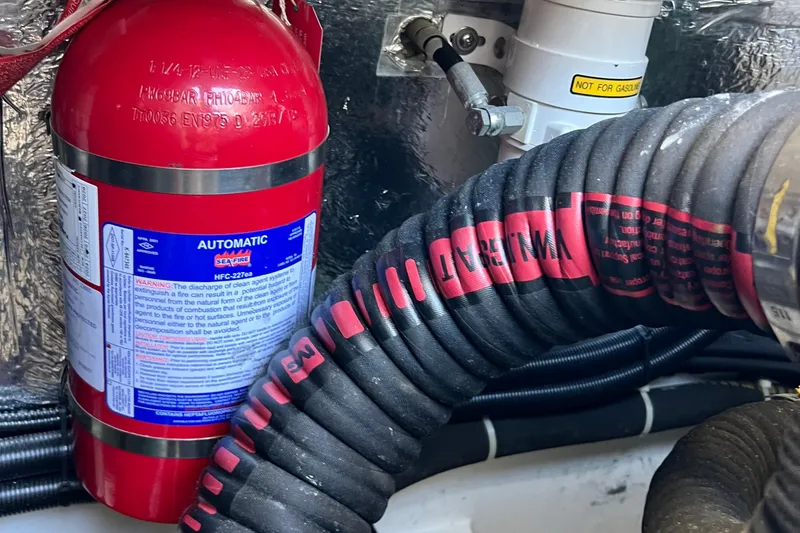 Kala Yacht Photos Pics Fire extinguisher and hoses in 2018 Nimbus 365 Coupe engine compartment.