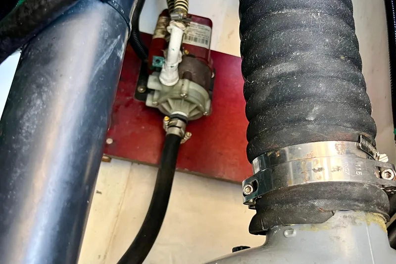 Kala Yacht Photos Pics Engine compartment of 2018 Nimbus 365 Coupe with visible hoses and clamps.