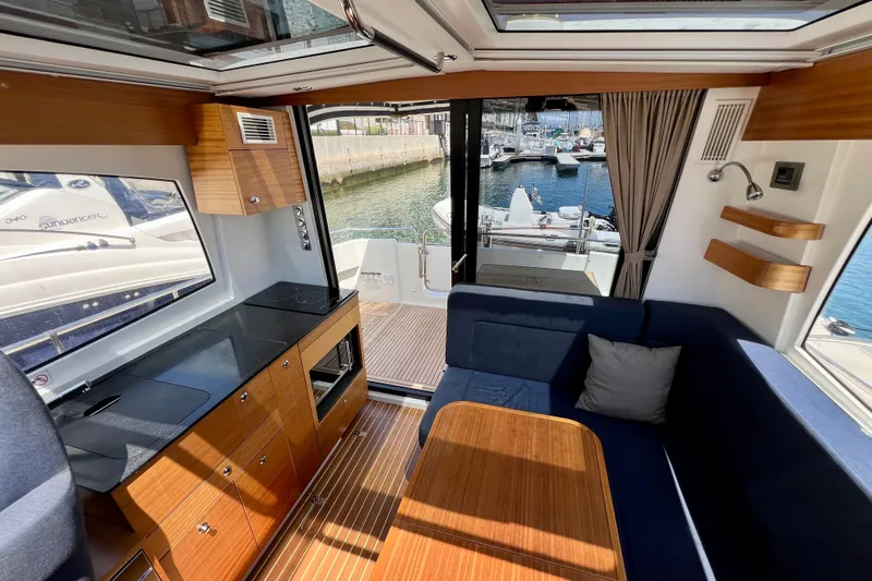 Kala Yacht Photos Pics Interior of 2018 Nimbus 365 Coupe yacht with modern kitchen and seating area.
