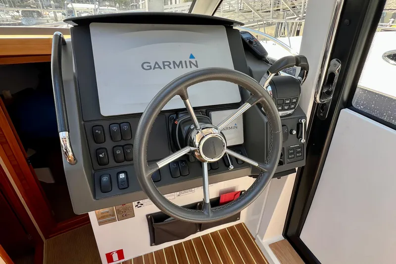 Kala Yacht Photos Pics Steering console of 2018 Nimbus 365 Coupe with Garmin navigation system.