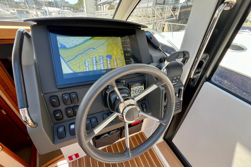 Kala Yacht Photos Pics Steering wheel and navigation system of 2018 Nimbus 365 Coupe boat.