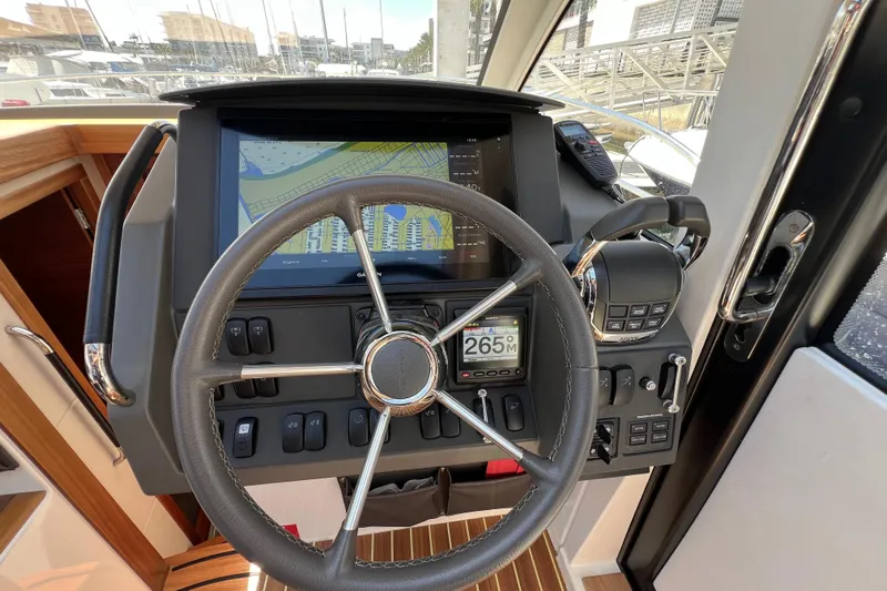 Kala Yacht Photos Pics Steering wheel and dashboard of 2018 Nimbus 365 Coupe with navigation display.