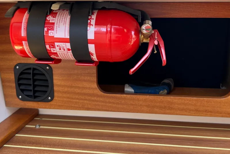 Kala Yacht Photos Pics Fire extinguisher mounted on 2018 Nimbus 365 Coupe wooden interior.