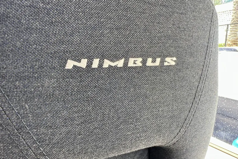 Kala Yacht Photos Pics Close-up of Nimbus 365 Coupe 2018 seat with logo on textured fabric.