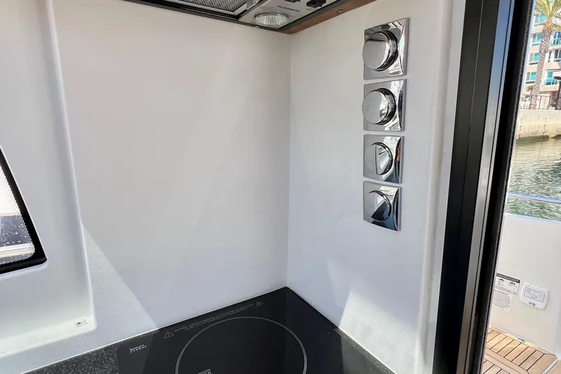 Kala Yacht Photos Pics Interior of 2018 Nimbus 365 Coupe with modern control panel and sleek design.