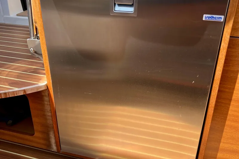 Kala Yacht Photos Pics Stainless steel appliance on 2018 Nimbus 365 Coupe boat with wooden interior detailing.