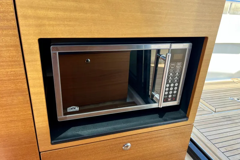 Kala Yacht Photos Pics Built-in microwave in 2018 Nimbus 365 Coupe yacht kitchen.