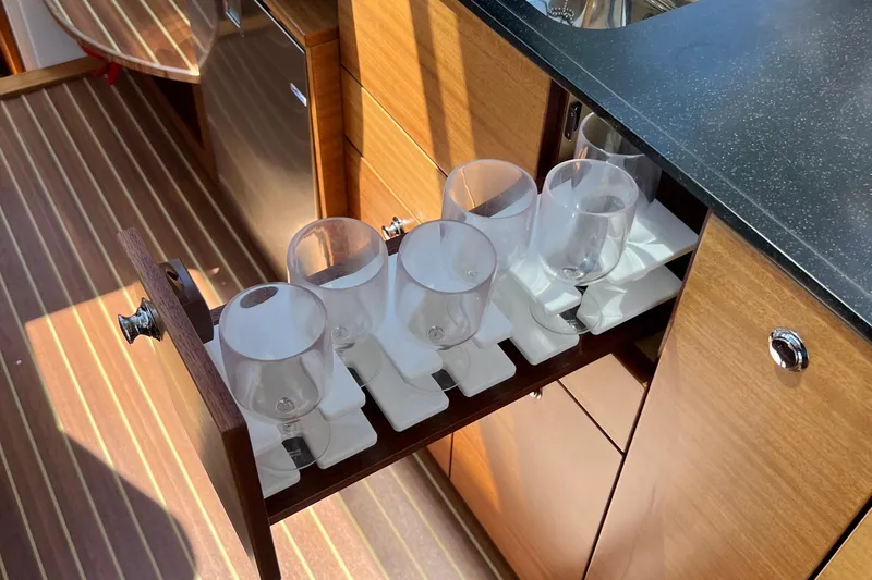 Kala Yacht Photos Pics Drawer with wine glasses in 2018 Nimbus 365 Coupe yacht interior.