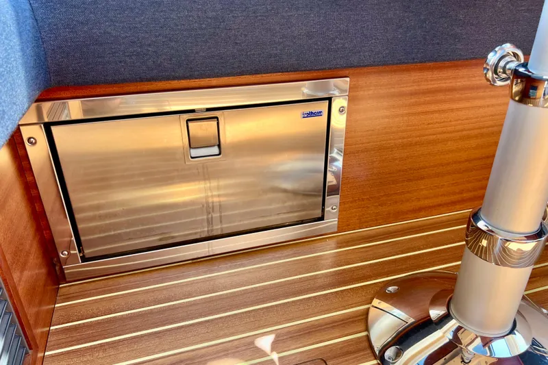 Kala Yacht Photos Pics Stainless steel hatch on 2018 Nimbus 365 Coupe boat with wooden interior.