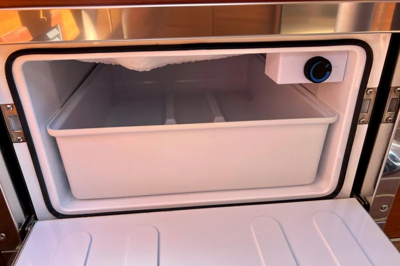 Kala Yacht Photos Pics Open freezer compartment in 2018 Nimbus 365 Coupe boat kitchen.