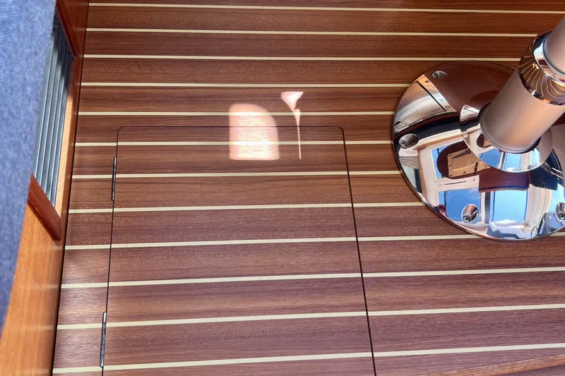Kala Yacht Photos Pics Teak deck of 2018 Nimbus 365 Coupe with polished metal fixture.