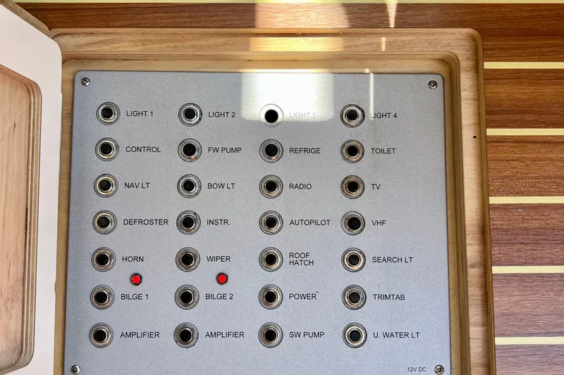 Kala Yacht Photos Pics Control panel of a 2018 Nimbus 365 Coupe boat with labeled switches and indicators.
