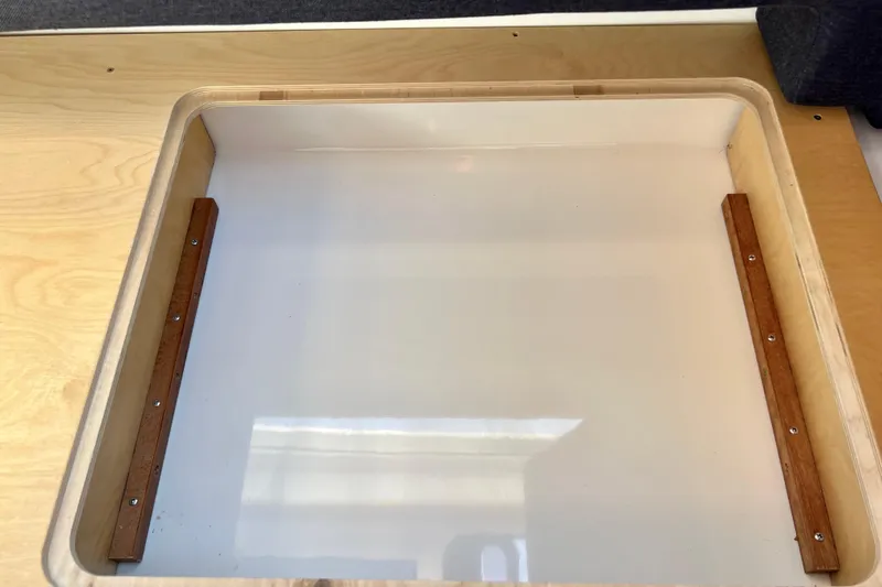 Kala Yacht Photos Pics Wooden storage compartment in 2018 Nimbus 365 Coupe boat interior.