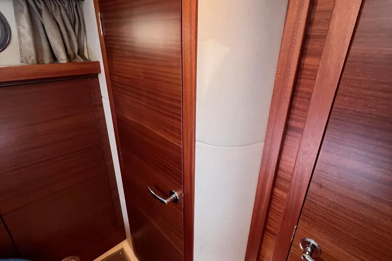 Kala Yacht Photos Pics Interior of 2018 Nimbus 365 Coupe featuring wooden doors and elegant curtains.