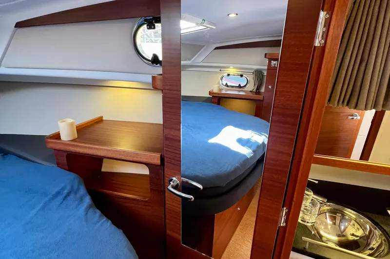 Kala Yacht Photos Pics Luxurious interior of 2018 Nimbus 365 Coupe yacht with cozy cabin and wooden finishes.