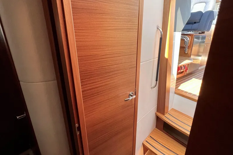 Kala Yacht Photos Pics Interior of 2018 Nimbus 365 Coupe, featuring wooden door and steps.