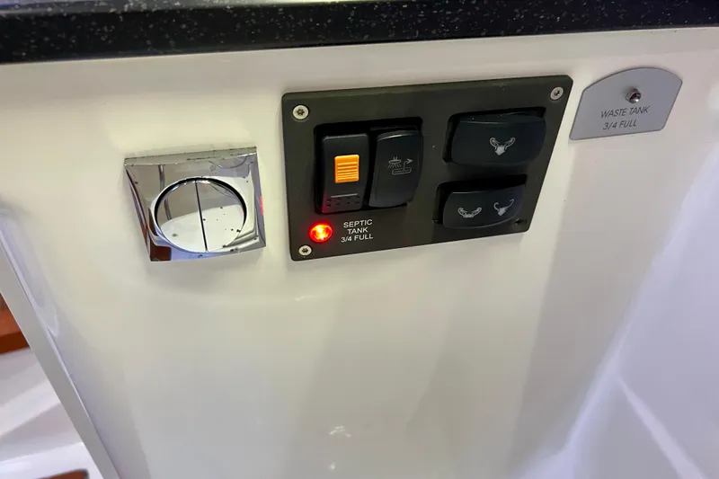 Kala Yacht Photos Pics Control panel of a 2018 Nimbus 365 Coupe showing waste tank indicators.