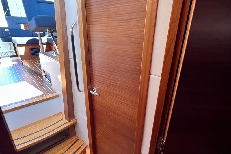 Kala Yacht Photos Pics Interior of 2018 Nimbus 365 Coupe, featuring wooden door and steps.