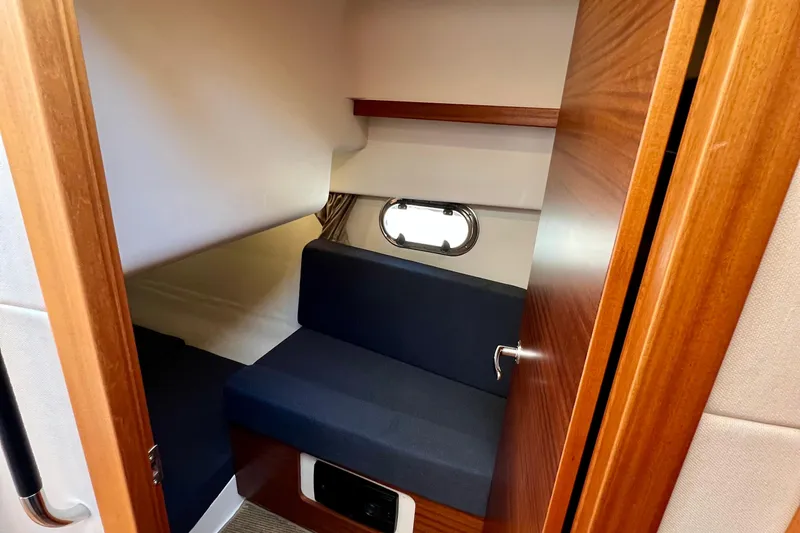 Kala Yacht Photos Pics Interior cabin of 2018 Nimbus 365 Coupe with wooden finish and seating.