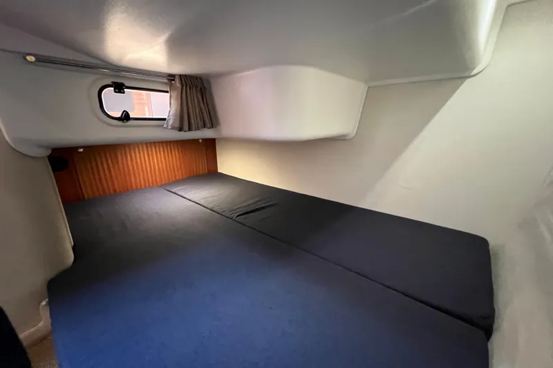 Kala Yacht Photos Pics Cozy cabin interior of 2018 Nimbus 365 Coupe with bed and window.