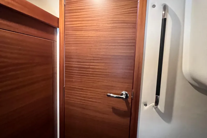 Kala Yacht Photos Pics Wooden interior door with chrome handle in 2018 Nimbus 365 Coupe boat.