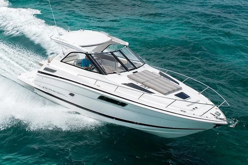 Popsicle Yacht Photos Pics 2019 Regal 35 Sport Coupe cruising on clear blue water.