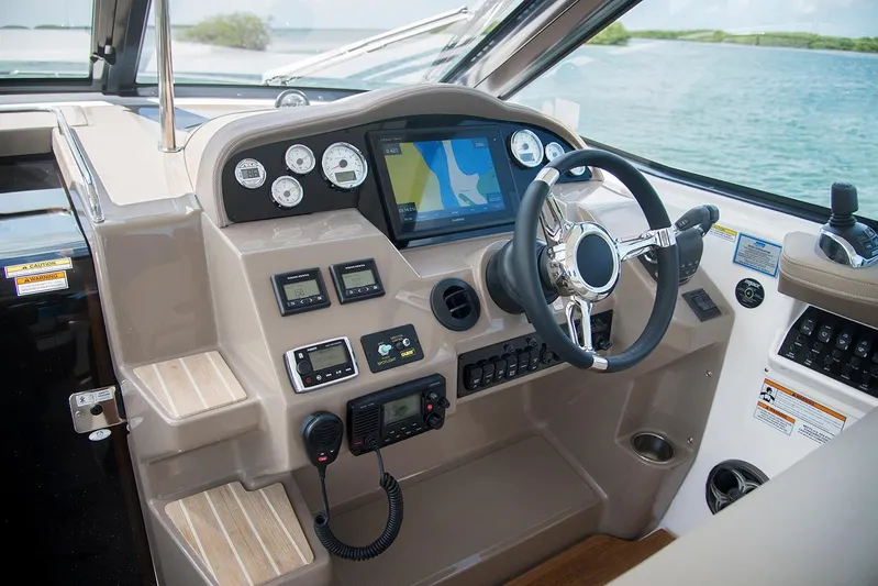 Popsicle Yacht Photos Pics Cockpit of 2019 Regal 35 Sport Coupe with navigation system and controls.