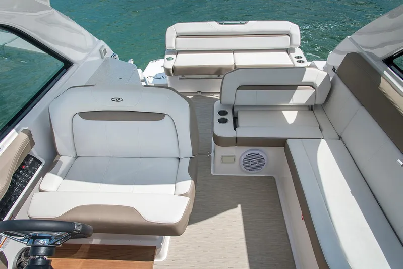 Popsicle Yacht Photos Pics 2019 Regal 35 Sport Coupe boat interior with white and beige seating.