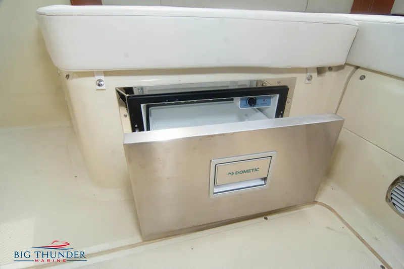  Yacht Photos Pics 2024 Invictus TT280S boat with built-in Dometic refrigerator, open for viewing.