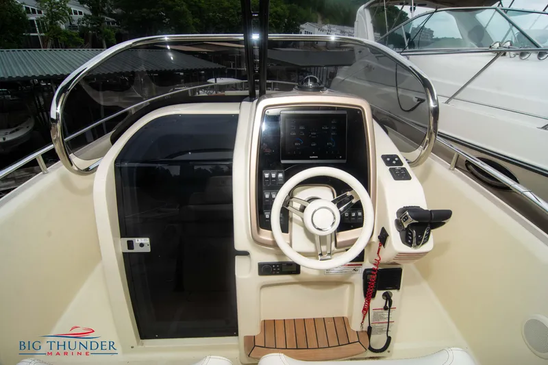  Yacht Photos Pics 2024 Invictus TT280S boat helm with modern controls and steering wheel at Big Thunder Marine.