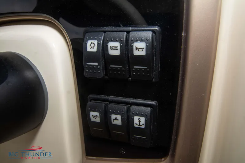  Yacht Photos Pics Dashboard switches on 2024 Invictus TT280S boat, featuring various control icons.