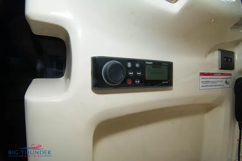  Yacht Photos Pics Control panel on 2024 Invictus TT280S boat, featuring Fusion MS-RA70 stereo system.