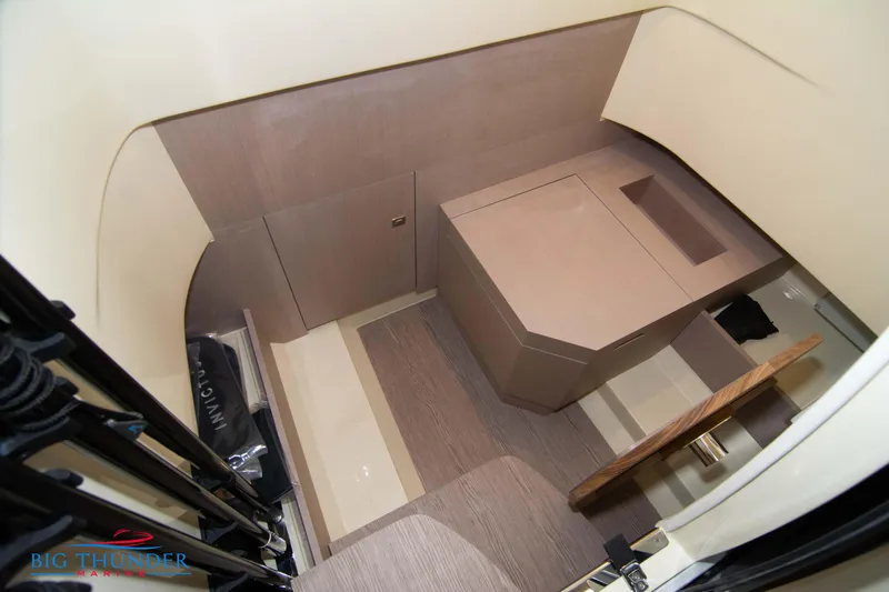  Yacht Photos Pics 2024 Invictus TT280S cabin interior with modern design and wood accents.