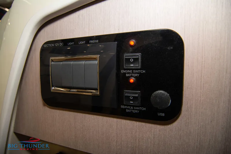  Yacht Photos Pics Control panel of 2024 Invictus TT280S boat with switches and USB port.