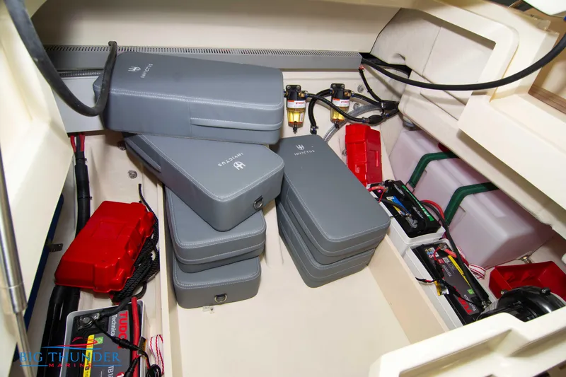  Yacht Photos Pics 2024 Invictus TT280S engine compartment with batteries and electrical components.
