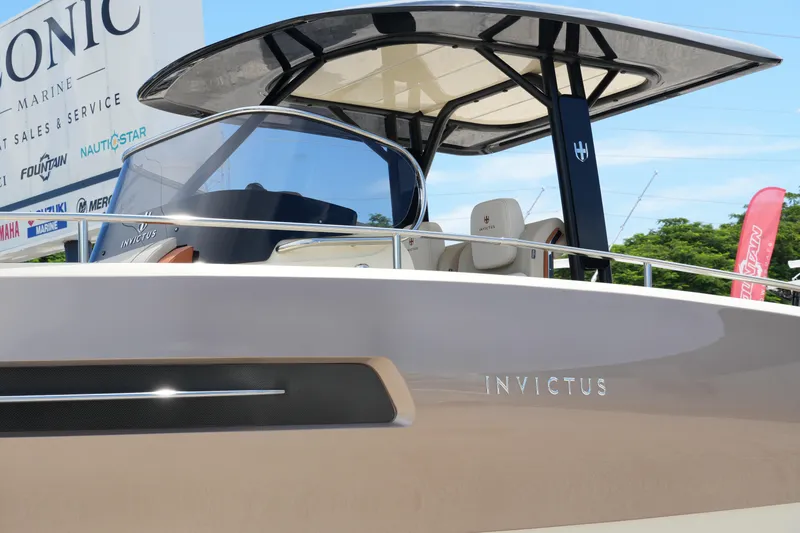  Yacht Photos Pics 2024 Invictus TT280S boat with sleek design at Iconic Marine dealership.