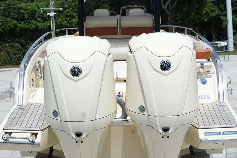  Yacht Photos Pics 2024 Invictus TT280S boat with dual outboard engines, rear view.