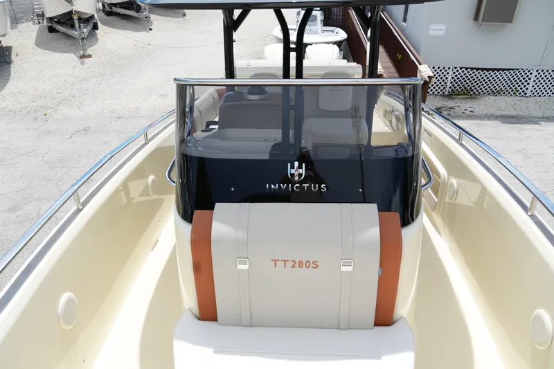  Yacht Photos Pics 2024 Invictus TT280S boat interior, showcasing sleek design and modern features.