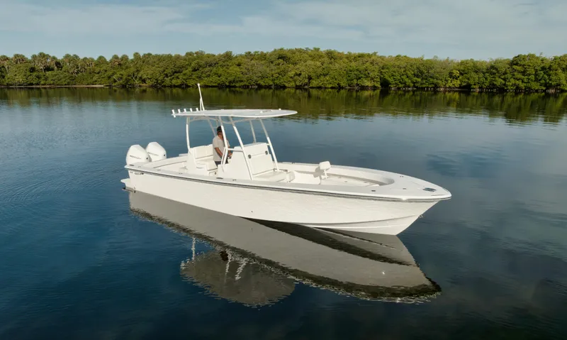 New Build Yacht Photos Pics 2024 Birdsall 30 boat on calm water with lush green shoreline in the background.