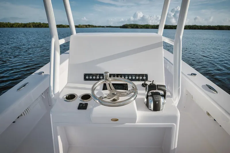 New Build Yacht Photos Pics 2024 Birdsall 30 boat console with steering wheel and controls on calm water.