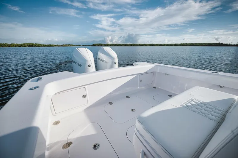 New Build Yacht Photos Pics 2024 Birdsall 30 boat with twin Mercury engines on a calm lake.